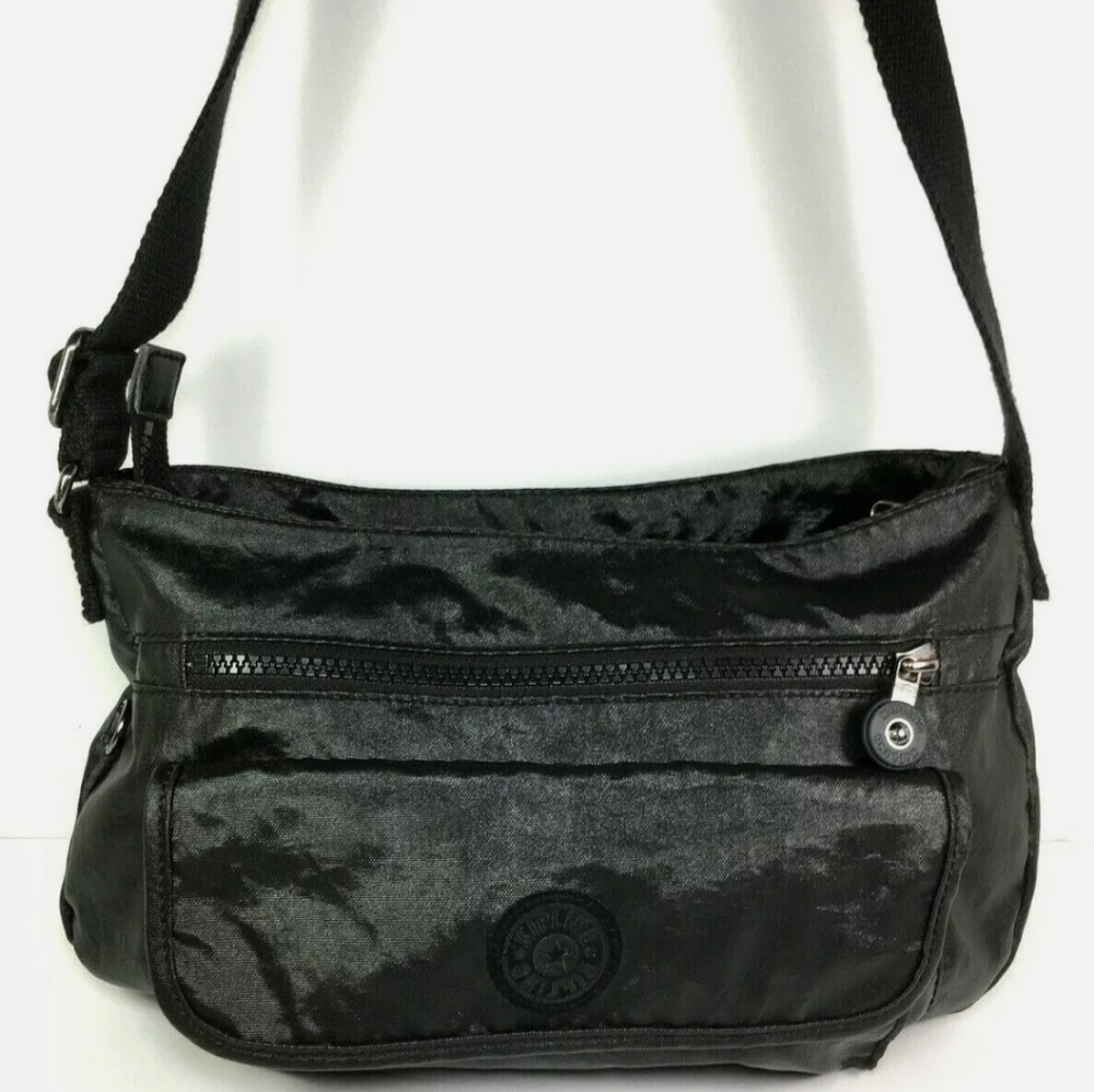 Kipling black lacquer coated look crossbody bag (marks on inside of  pocket)